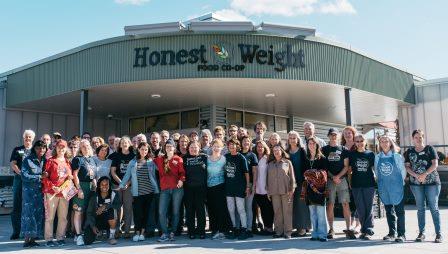 Honest Weight Staff, Shareholders & Member-Owners standing outside the store