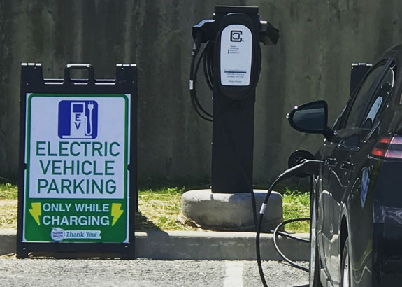 Electric vehicle at HWFC charging at EV charging station